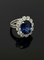 Bague 52 Cœur de l’Océan - Bague marguerite en or blanc 750, saphir et diamants 58 Facettes