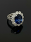 Bague 52 Cœur de l’Océan - Bague marguerite en or blanc 750, saphir et diamants 58 Facettes