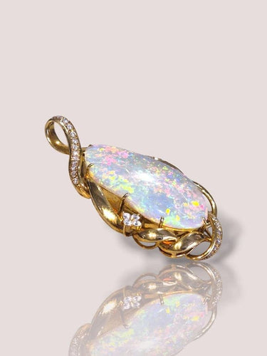 Pendentif Pendentif vintage en or jaune 18 carats avec opale et diamants 58 Facettes 60023898