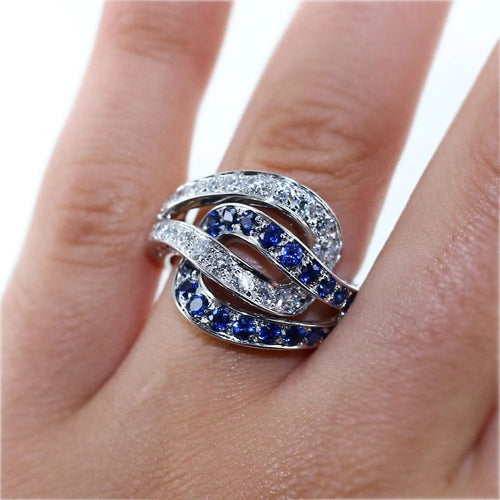 Bague 53 Bague entrelacée en or gris, saphirs et diamants 58 Facettes