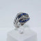 Bague 53 Bague entrelacée en or gris, saphirs et diamants 58 Facettes
