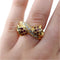 Bague 56 Bague croisée nœud en or jaune, diamants et rubis 58 Facettes