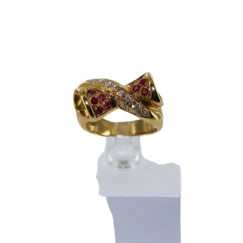 Bague 56 Bague croisée nœud en or jaune, diamants et rubis 58 Facettes