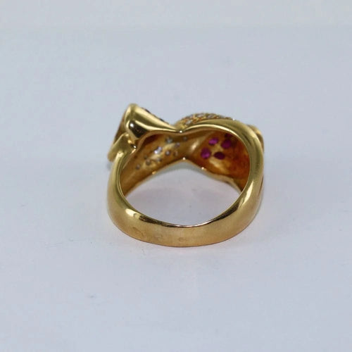 Bague 56 Bague croisée nœud en or jaune, diamants et rubis 58 Facettes