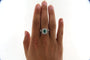 Bague 57 Bague marguerite en or gris 18 carats, émeraude et diamants 58 Facettes 5792t
