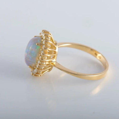 Bague 60 Bague cocktail en or jaune 18K avec opale et diamants 58 Facettes