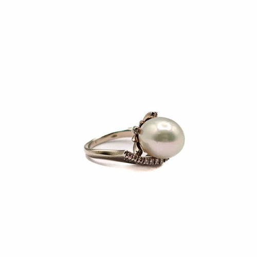 Bague 50 Bague vintage en or blanc 18 carats avec perle de mer et diamants 58 Facettes 21002380
