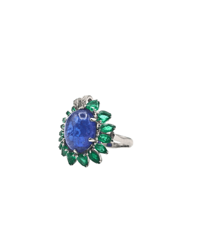 Bague Bague cocktail en or blanc 18 carats avec tanzanite, émeraudes et diamants 58 Facettes 21003769