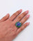 Bague Bague cocktail en or blanc 18 carats avec tanzanite, émeraudes et diamants 58 Facettes 21003769