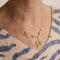 Collier Collier draperie aux œillets en or jaune 18 carats et perles 58 Facettes
