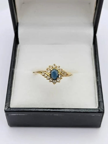Bague 57 Bague tourbillon en or jaune 18k avec saphir ovale et diamants 58 Facettes