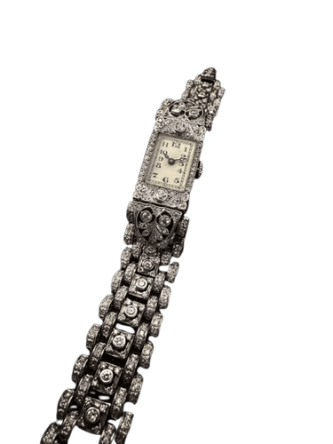 Montre Montre Art déco rectangulaire en platine et or blanc sertie de diamants 58 Facettes