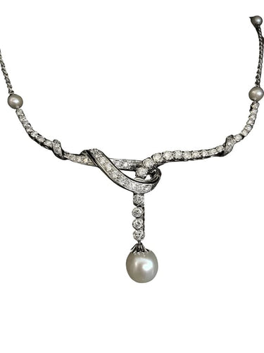 Collier Collier en or blanc 18 carats, perle de culture et diamants 58 Facettes