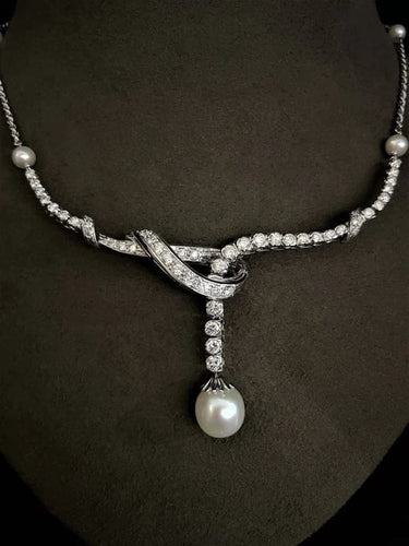 Collier Collier en or blanc 18 carats, perle de culture et diamants 58 Facettes