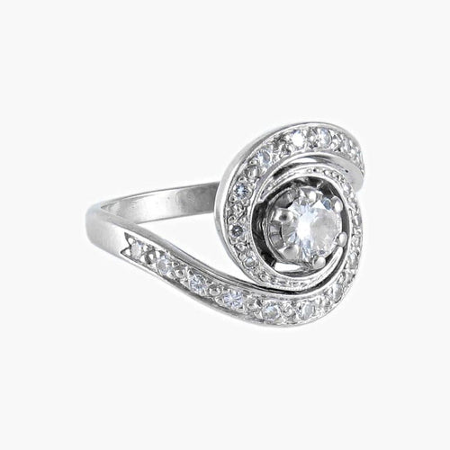 Bague 50 Bague tourbillon en or blanc 18K et diamants 58 Facettes