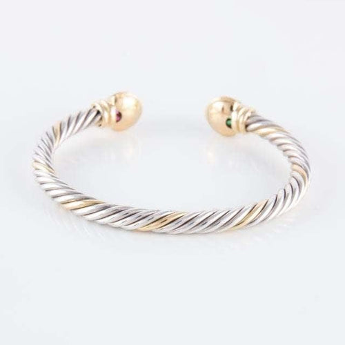Bracelet Bracelet jonc ouvert en or jaune 18 ct, rubis et émeraudes 58 Facettes HS20836