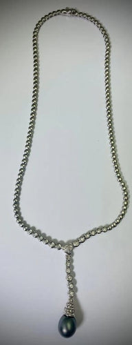 Collier Collier en or blanc 18 carats avec perle et diamants 58 Facettes