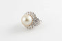Bague 54.5 Bague en or blanc avec perle de culture eau de mer et diamants 58 Facettes 154329
