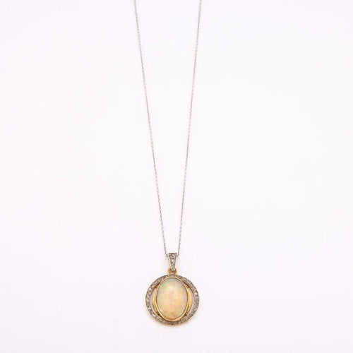 Collier Collier pendentif en or jaune et gris 18K à opale et diamants 58 Facettes