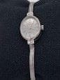 Montre Montre dame ovale en or gris et diamants 58 Facettes