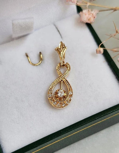 Pendentif Pendentif vintage entrelacé en or rose 18 carats et diamants 58 Facettes 643
