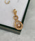 Pendentif Pendentif vintage entrelacé en or rose 18 carats et diamants 58 Facettes 643