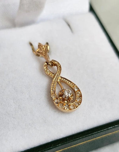 Pendentif Pendentif vintage entrelacé en or rose 18 carats et diamants 58 Facettes 643