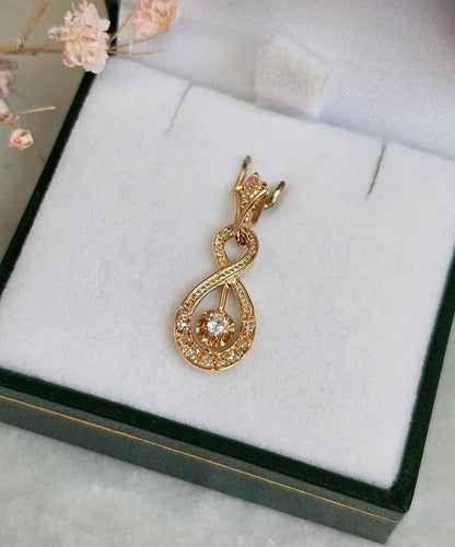 Pendentif Pendentif vintage entrelacé en or rose 18 carats et diamants 58 Facettes 643