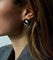 Boucles d'oreilles Boucles d’oreilles nœud en or jaune et émail amarante guilloché 58 Facettes