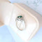 Bague 53.5 MATY - Bague de fiançailles en or blanc 18K, émeraude et diamants 58 Facettes AA 1741