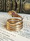 Bague 64-65 Bague serpent ancienne en or rose 18k, rubis et diamants 58 Facettes