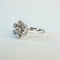Bague 47 Bague marguerite n° 38 en or gris 18 carats et diamants 58 Facettes INV038