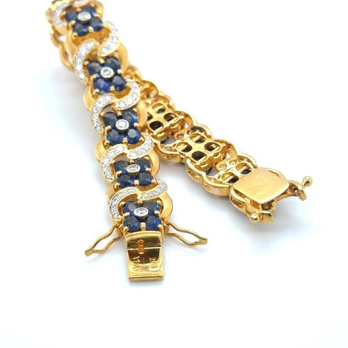Bracelet Bracelet en or jaune 22 carats serti de saphirs et diamants 58 Facettes 1.0002546/1