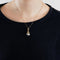 Pendentif Pendentif en or jaune 18 carats et perle baroque grise 58 Facettes
