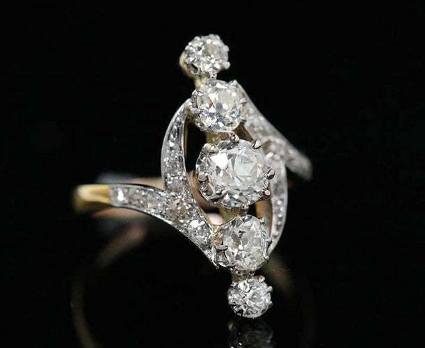 Bague 49 Bague Belle Époque marquise en or, platine et diamants 58 Facettes