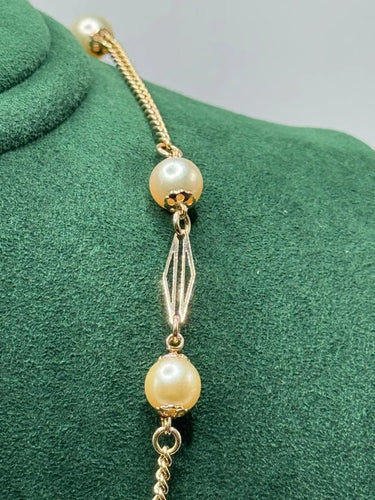 Collier Collier en or jaune 18 carats et perles naturelles 58 Facettes