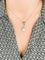 Collier Collier nœud - Pendentif en platine avec perle fine, diamants et émeraudes 58 Facettes 1184