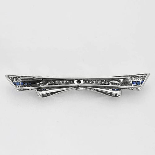 Broche Broche ruban en platine - Diamants et saphirs calibrés 58 Facettes YD4