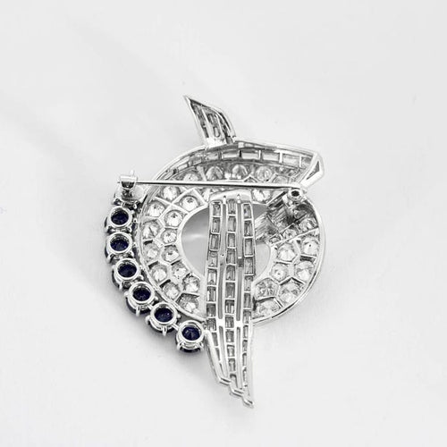 Broche Broche mouvementée en platine 950, saphirs et diamants 58 Facettes YD6