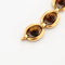 Bracelet Boucheron - Bracelet vintage en or jaune et œil de tigre 58 Facettes