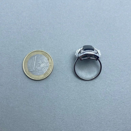 Bague 57 Bague en or blanc 14 kt avec diamants et onyx 58 Facettes