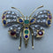Broche Broche en or jaune 14 ct, argent, diamants et pierres de couleur 58 Facettes