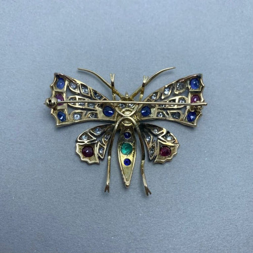 Broche Broche en or jaune 14 ct, argent, diamants et pierres de couleur 58 Facettes