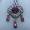 Collier Collier en or jaune 14 carats, argent, diamants et rubis 58 Facettes