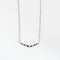 Collier Collier en or blanc 18 carats avec rubis, émeraudes et diamants 58 Facettes 1056180