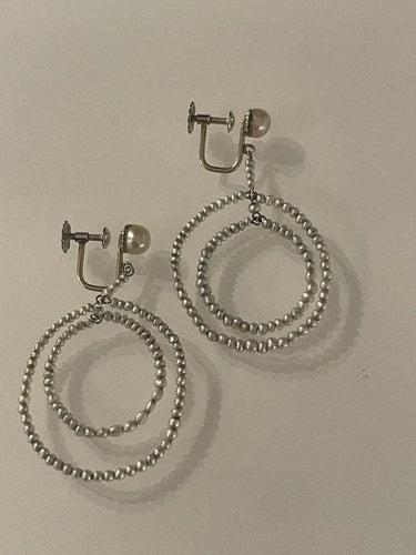 Boucles d'oreilles Boucles d’oreilles - Disques de perles fines en or gris 58 Facettes 896941