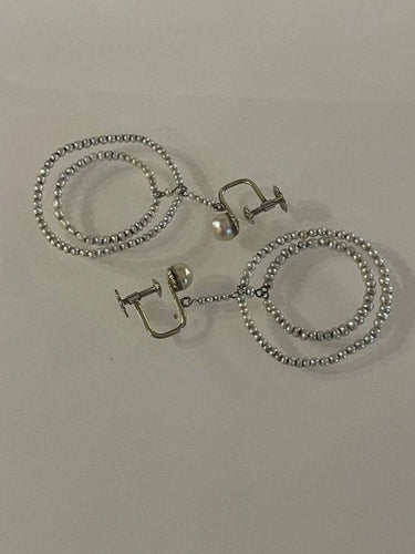 Boucles d'oreilles Boucles d’oreilles - Disques de perles fines en or gris 58 Facettes 896941