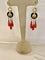 Boucles d'oreilles Boucles d’oreilles pendantes en or jaune 18 carats, onyx, corail et perles fines 58 Facettes 862568