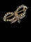 Broche Broche nœud Napoléon III en or et argent sertie de diamants 58 Facettes