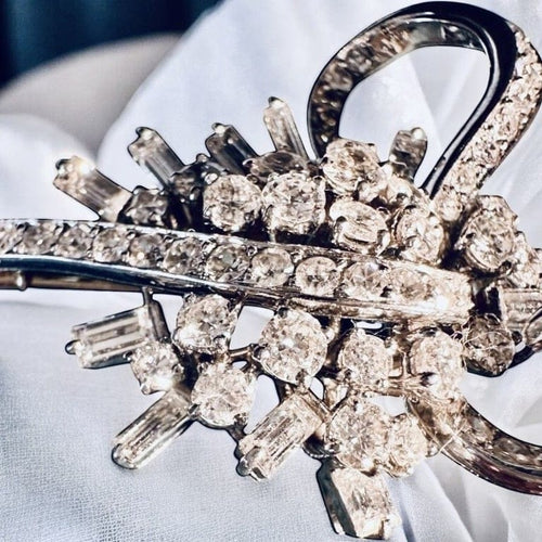 Broche Broche Art déco en or gris et platine, diamants 58 Facettes